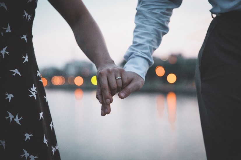 photo of a couple holding hands